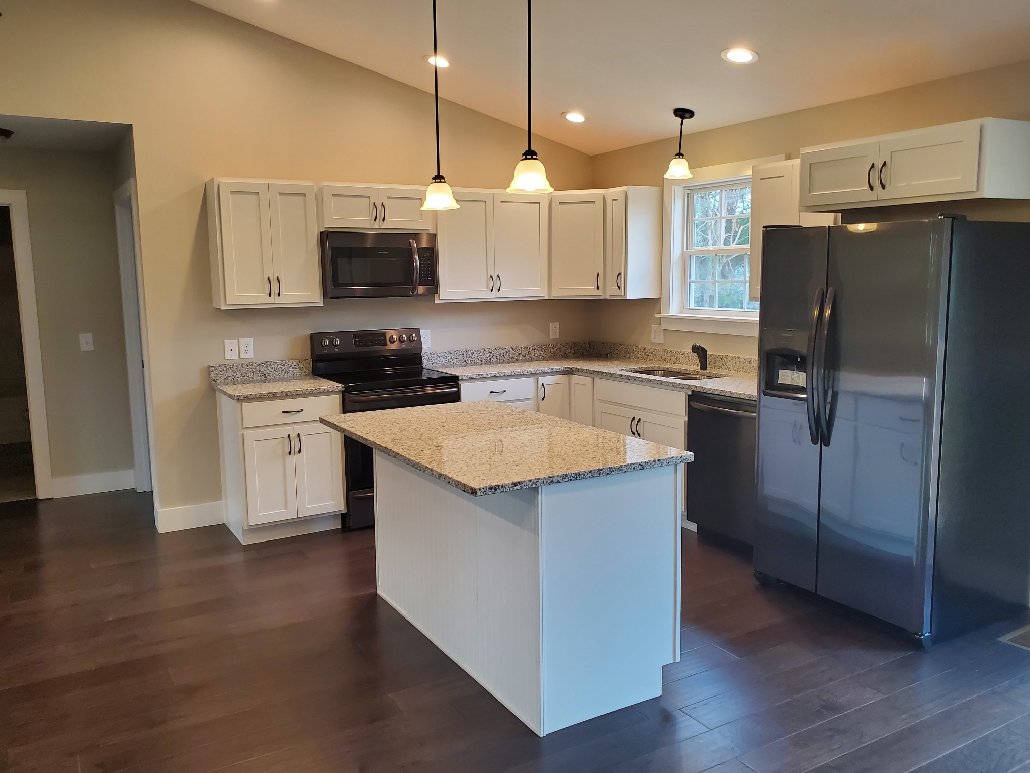 155 Bellwood Road Lebanon, TN 37087 - Photo 9 of 16 a kitchen with a sink a microwave a refrigerator and cabinets