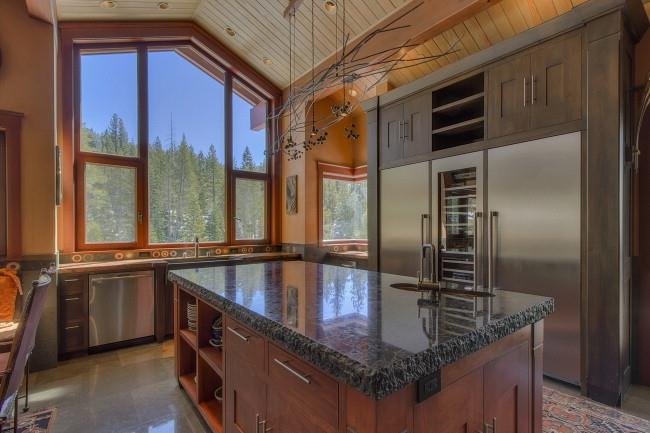 91 Winding Creek Road Olympic Valley, CA 96146 - Photo 8 of 14 a kitchen with stainless steel appliances granite countertop a sink a stove and a refrigerator