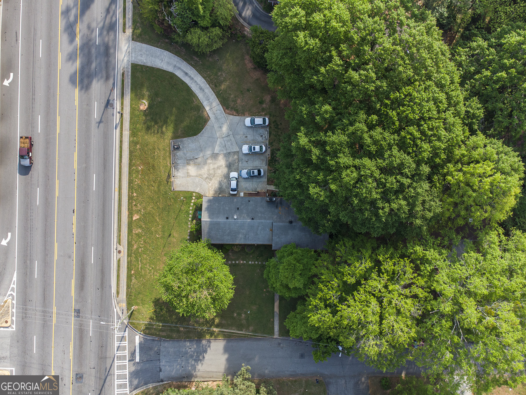 4317 Lavista Road Tucker, GA 30084 - Photo 4 of 5 an aerial view of a house with garden space and a street view