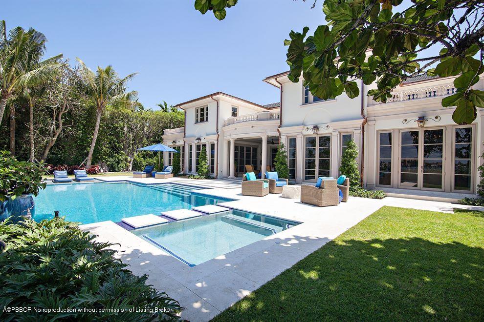 390 North Lake Way Palm Beach, FL 33480 - Photo 1 of 25 a view of a house with swimming pool and a yard