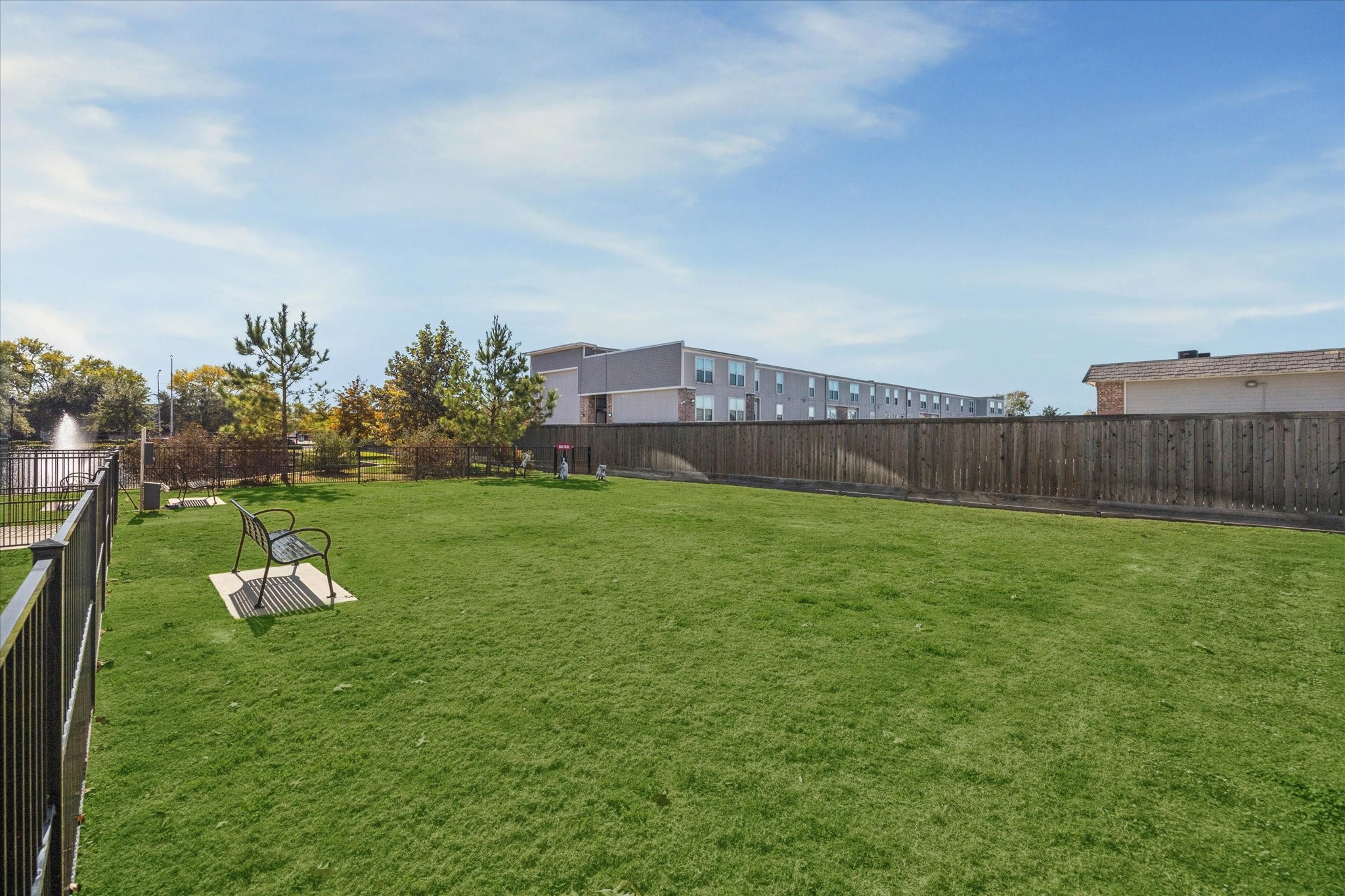6804 Westview Drive, Unit 2205 Houston, TX 77055 - Photo 18 of 23 Residents can enjoy a fully enclosed, manicured pet park, providing a safe and spacious environment for pets to run and socialize. This dedicated outdoor space offers a convenient community amenity for pet owners to gather while their companions play.