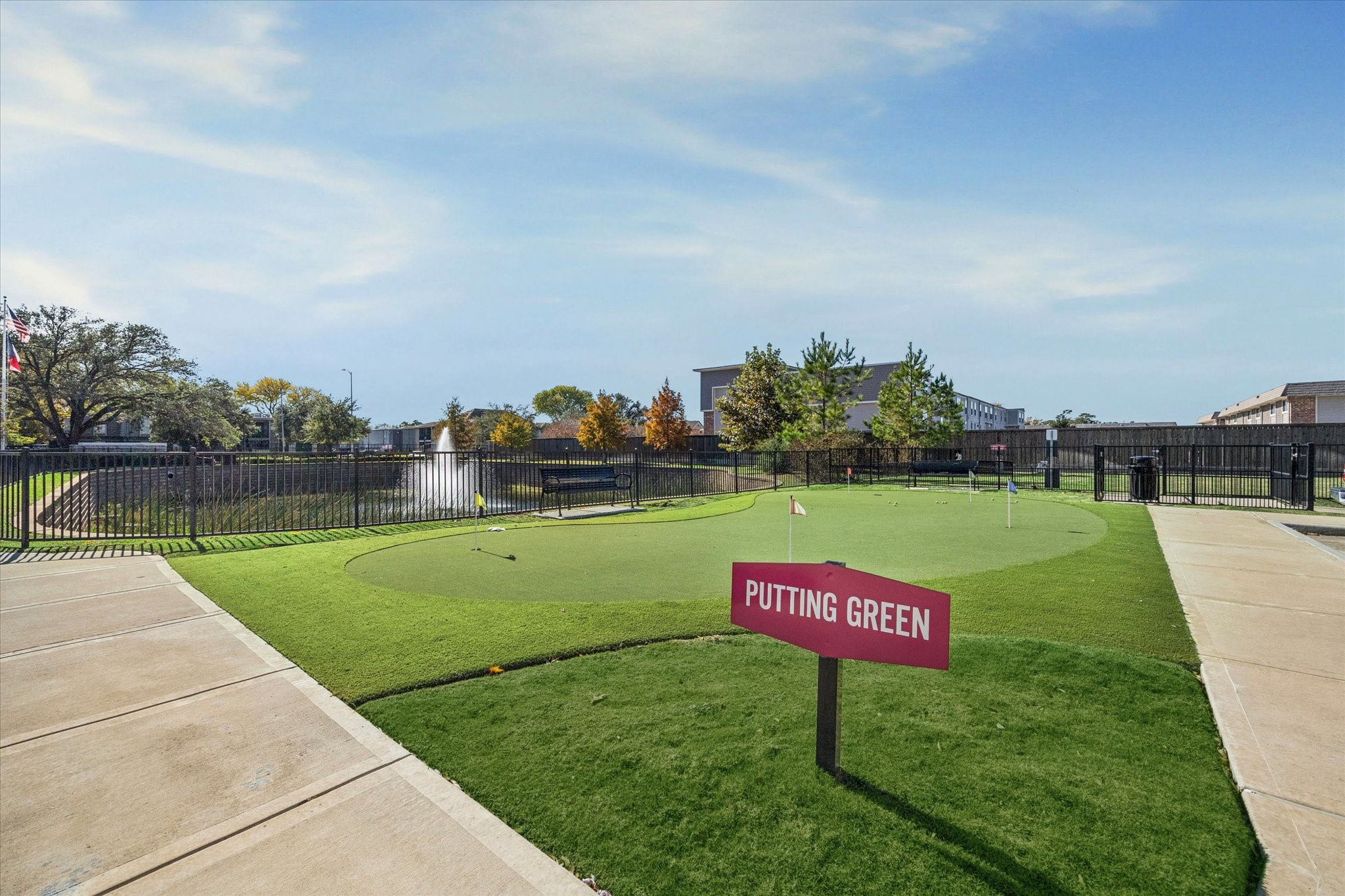 6804 Westview Drive, Unit 2205 Houston, TX 77055 - Photo 19 of 23 Residents can sharpen their game on the professional putting green, a premium outdoor amenity perfect for leisure and practice. This manicured green space offers a fun and engaging social environment for golfers of all skill levels.