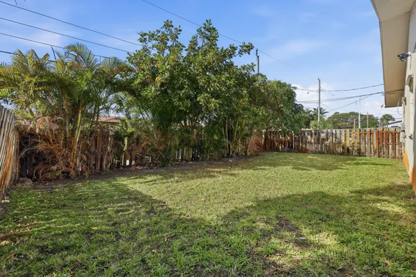 a backyard of a house with lots of green space