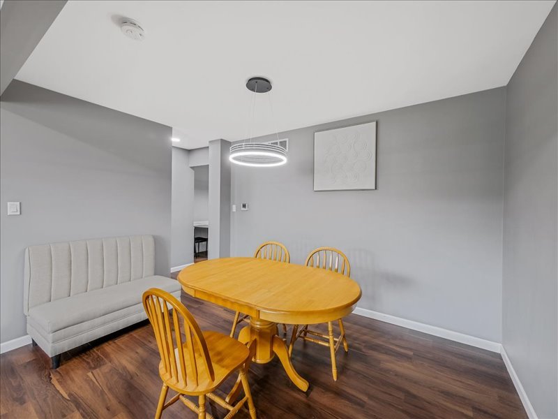 1968 Holbrook Lane Hoffman Estates, IL 60169 - Photo 13 of 31 a view of a dining room with furniture and wooden floor
