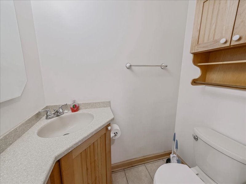 1968 Holbrook Lane Hoffman Estates, IL 60169 - Photo 14 of 31 a bathroom with a sink and a vanity