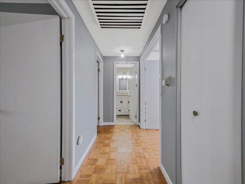 1968 Holbrook Lane Hoffman Estates, IL 60169 - Photo 18 of 31 a view of a hallway with wooden shelves