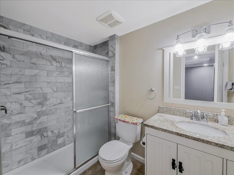 1968 Holbrook Lane Hoffman Estates, IL 60169 - Photo 24 of 31 a bathroom with a granite countertop sink toilet and shower