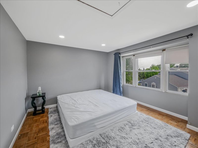 1968 Holbrook Lane Hoffman Estates, IL 60169 - Photo 25 of 31 a bed room with a bed and a window
