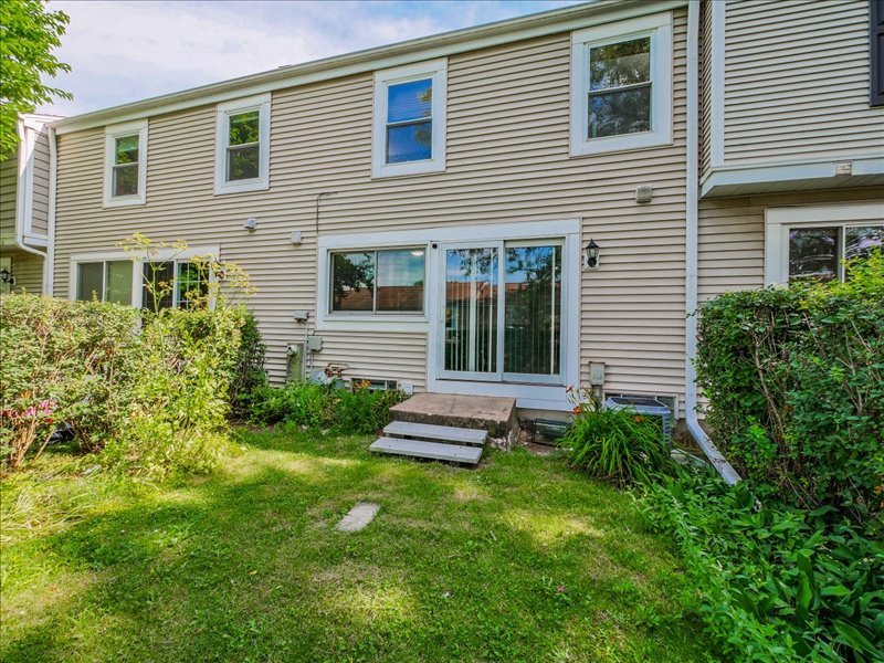 1968 Holbrook Lane Hoffman Estates, IL 60169 - Photo 28 of 31 a front view of a house with a garden
