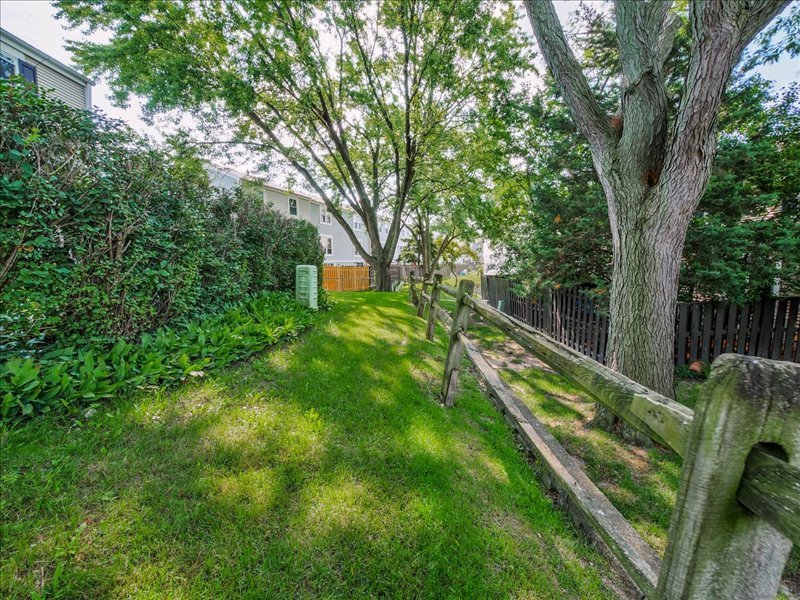 1968 Holbrook Lane Hoffman Estates, IL 60169 - Photo 29 of 31 a view of a house with a yard