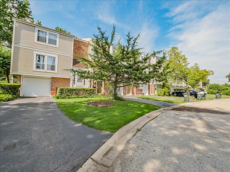1968 Holbrook Lane Hoffman Estates, IL 60169 - Photo 3 of 31 a view of a house with a yard
