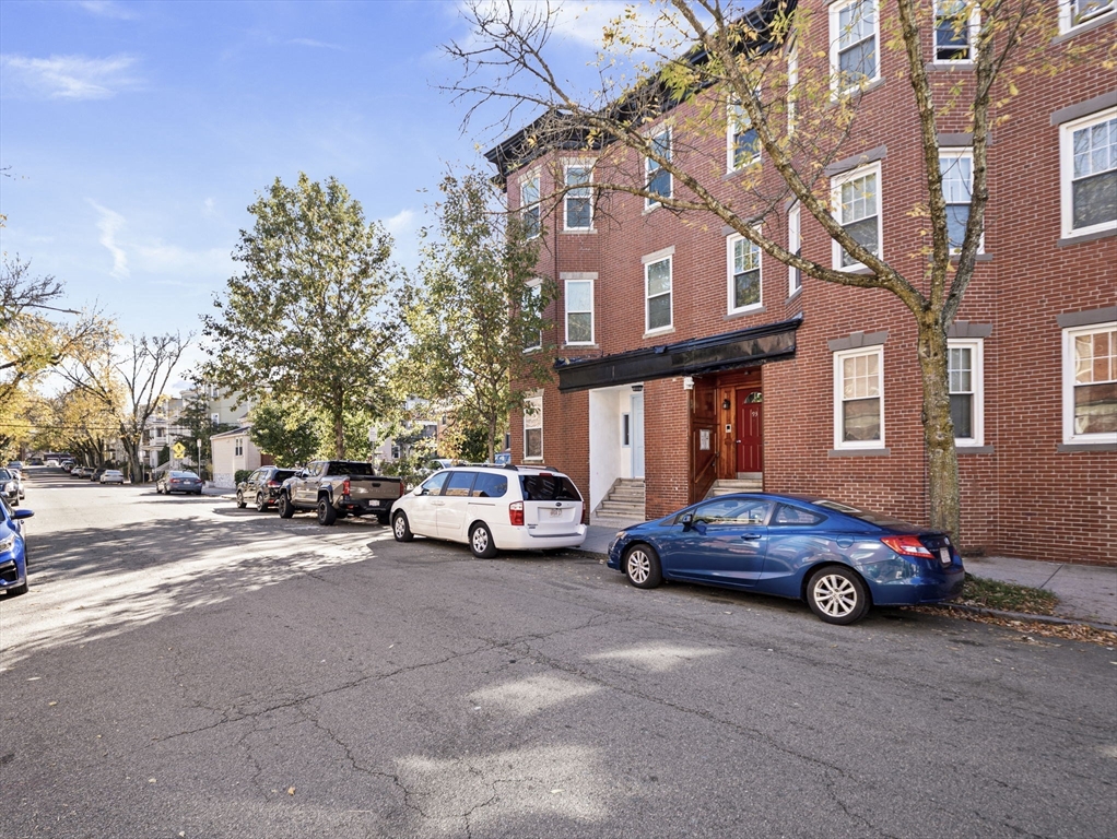 95 Florida Street, Unit 2 Boston, MA 02124 - Photo 28 of 29 a car parked in front of a building