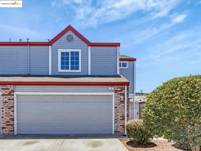 a front view of a house with a garage