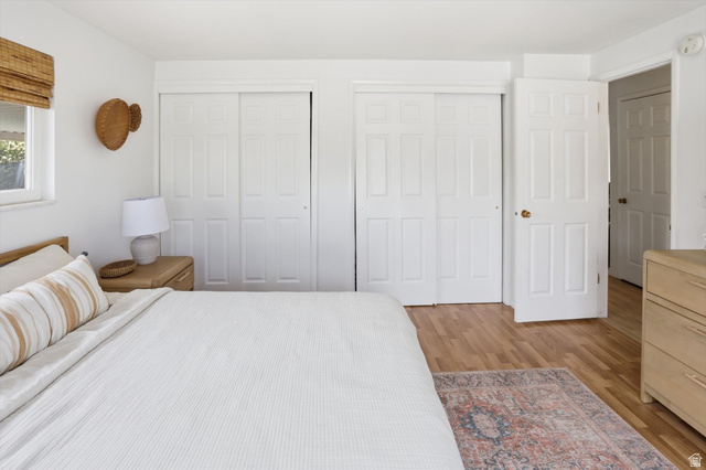 5108 South 2000th Street West Roy, UT 84067 - Photo 24 of 61 Bedroom featuring two closets and light wood finished floors