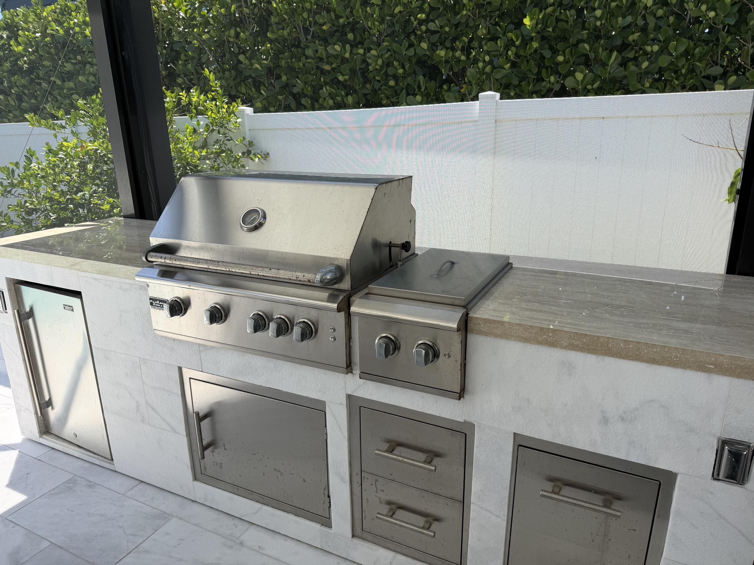 112 Capri Boulevard Naples, FL 34113 - Photo 24 of 29 a view of barbeque grill with yard
