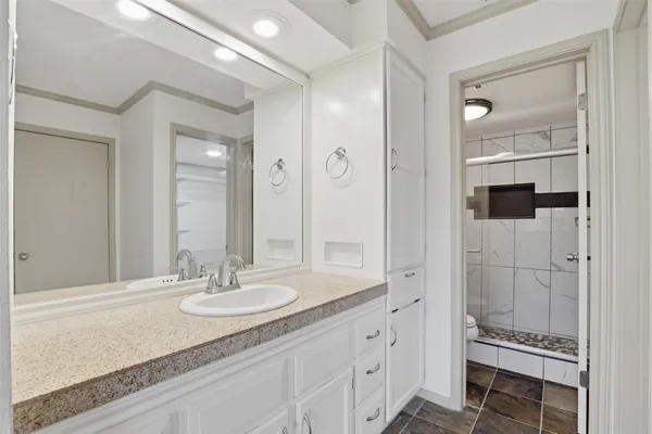 a bathroom with a sink double vanity and a mirror