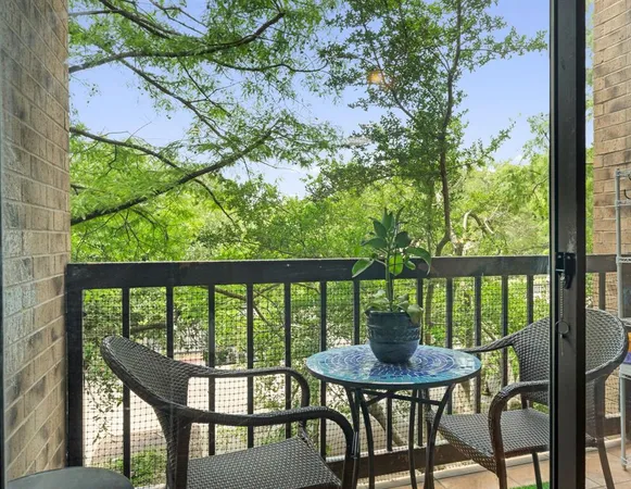 a view of a chairs and table in patio