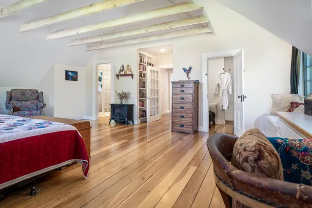 a backyard of a house with lots of green space and lake view