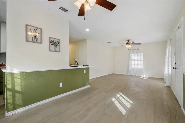 a view of an empty room with a window