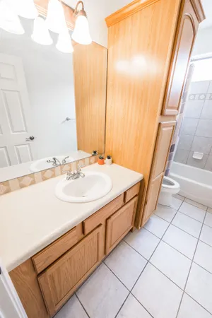 a bathroom with a sink a vanity and a mirror