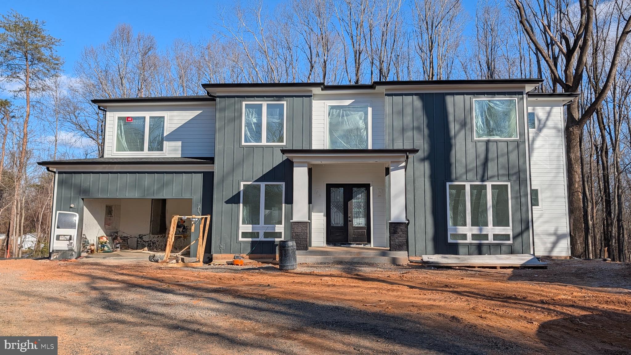 a view of a house with wooden floor and a fireplace