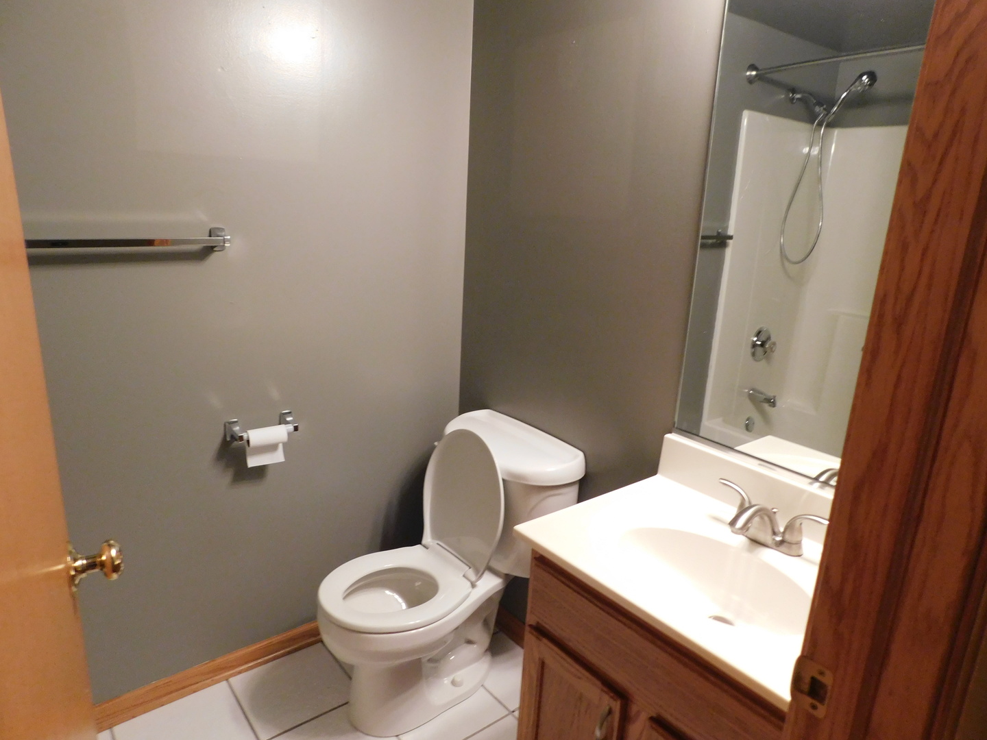 18100 Rita Road, Unit 1B Tinley Park, IL 60477 - Photo 13 of 24 a bathroom with a toilet sink and vanity