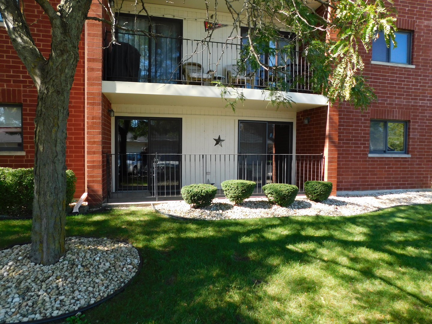 18100 Rita Road, Unit 1B Tinley Park, IL 60477 - Photo 2 of 24 a view of a house with backyard and porch