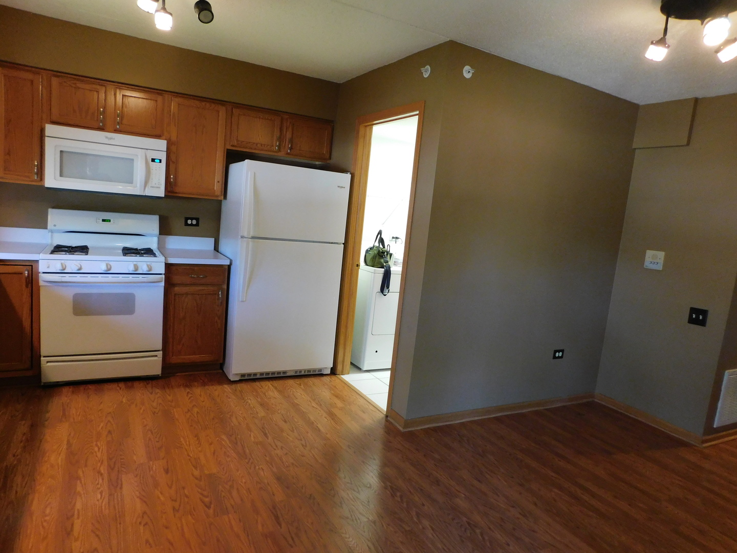 18100 Rita Road, Unit 1B Tinley Park, IL 60477 - Photo 9 of 24 a kitchen with stainless steel appliances a refrigerator and a stove top oven