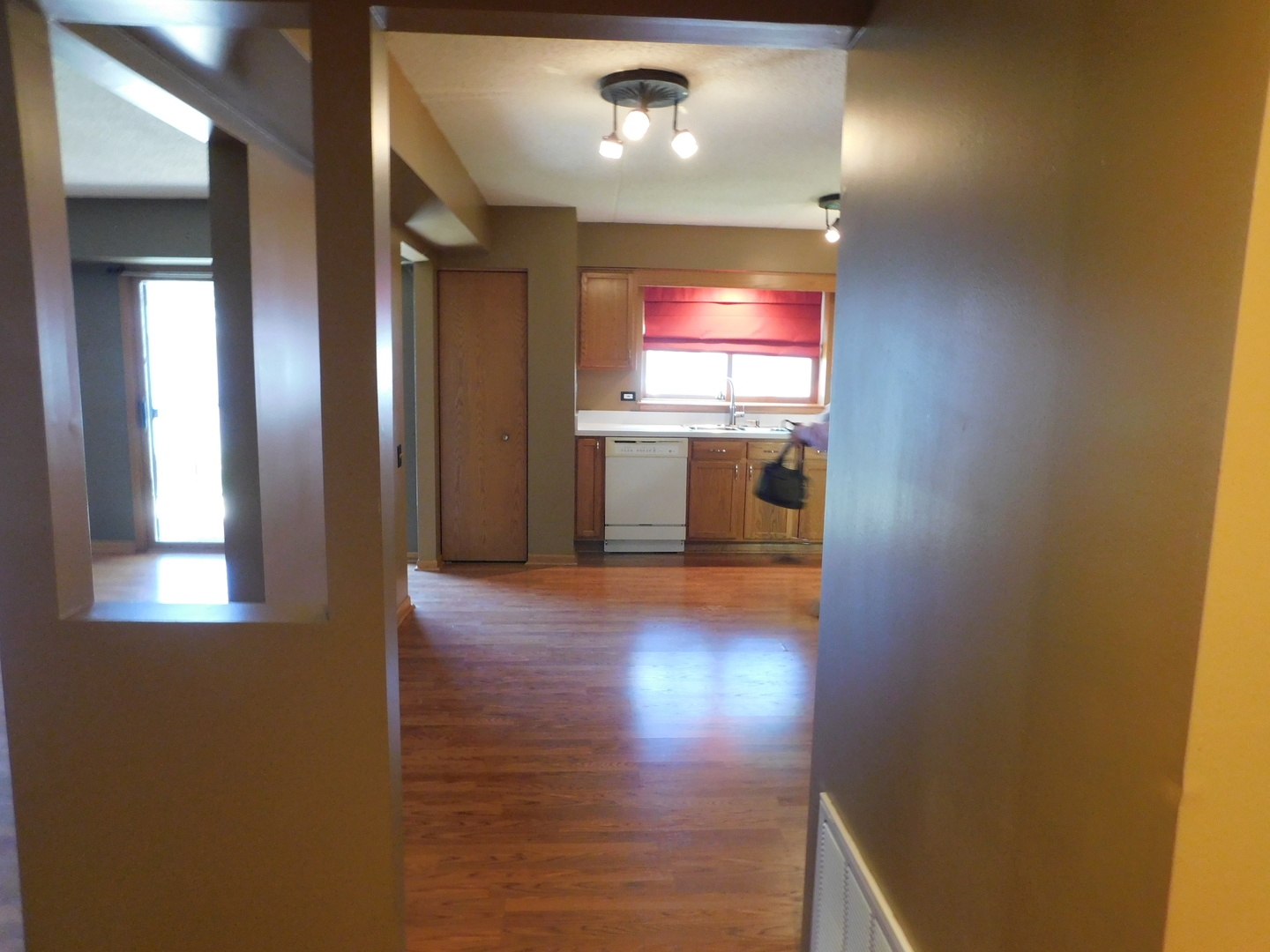 18100 Rita Road, Unit 1B Tinley Park, IL 60477 - Photo 10 of 24 a view of a livingroom with wooden floor and window
