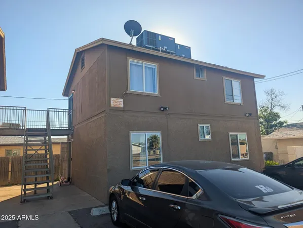 a front view of a house with parking area