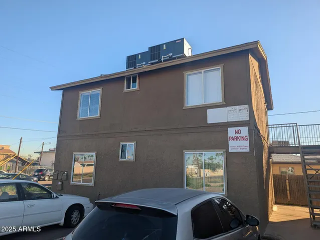 a front view of a house with parking space