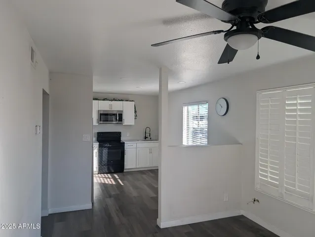 a kitchen with stainless steel appliances a refrigerator and a stove