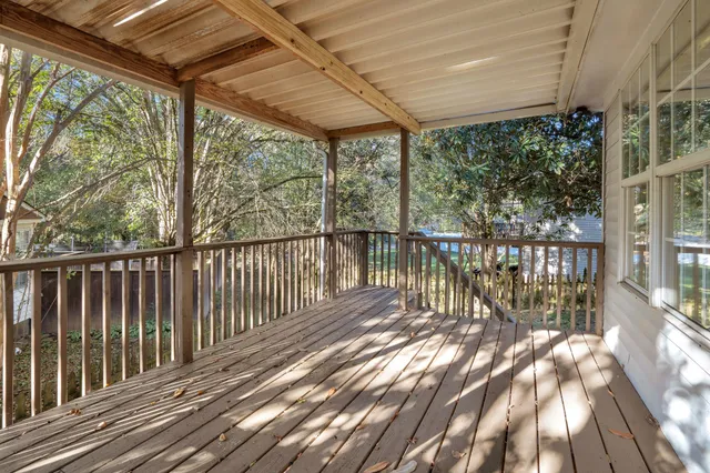 a view of balcony with wooden floor