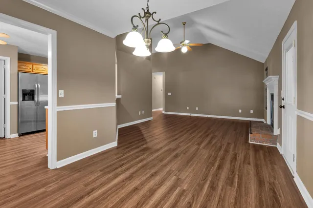 a view of room with wooden floor