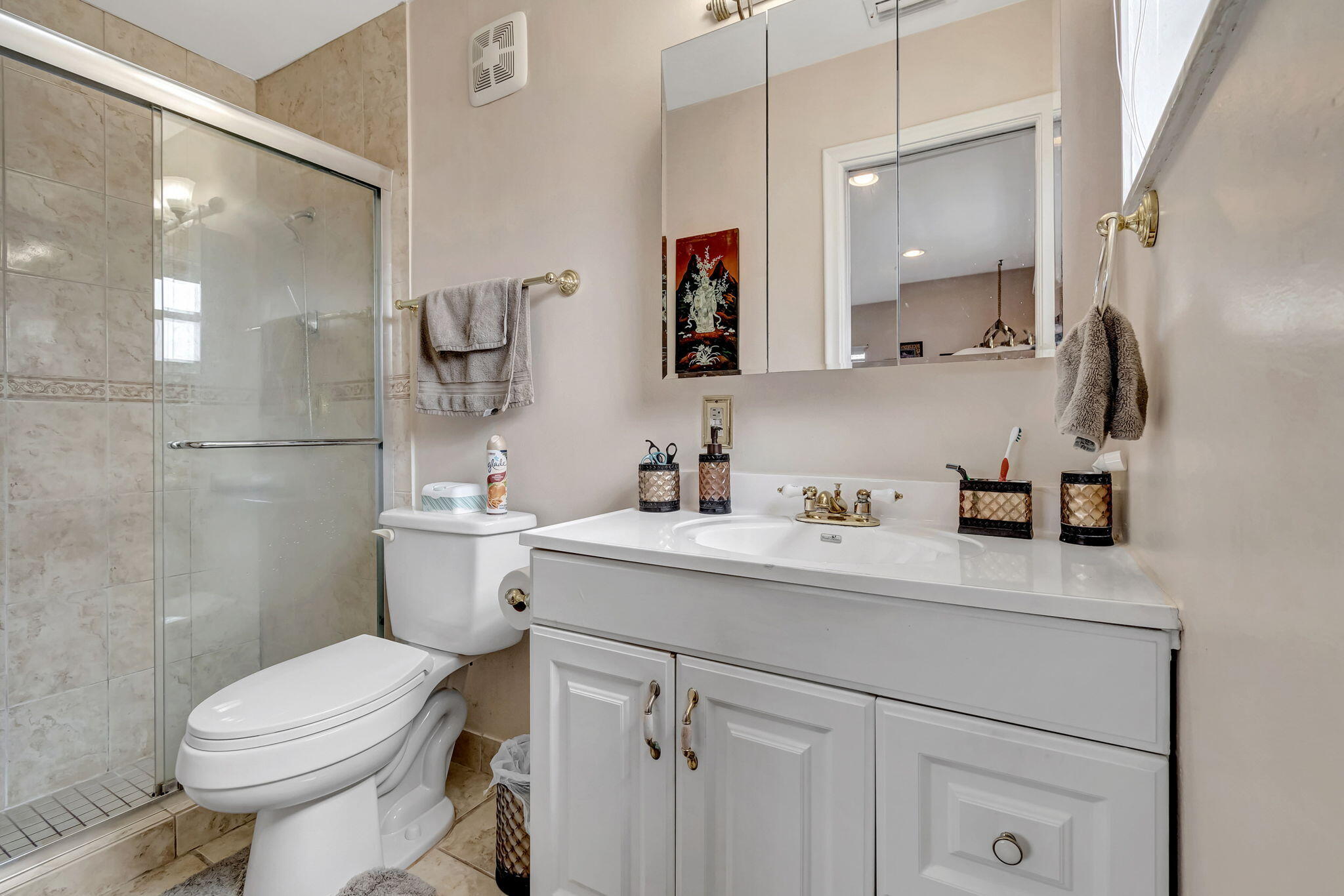 4557 Avalon Street Boca Raton, FL 33428 - Photo 22 of 47 a bathroom with a granite countertop sink mirror vanity and toilet