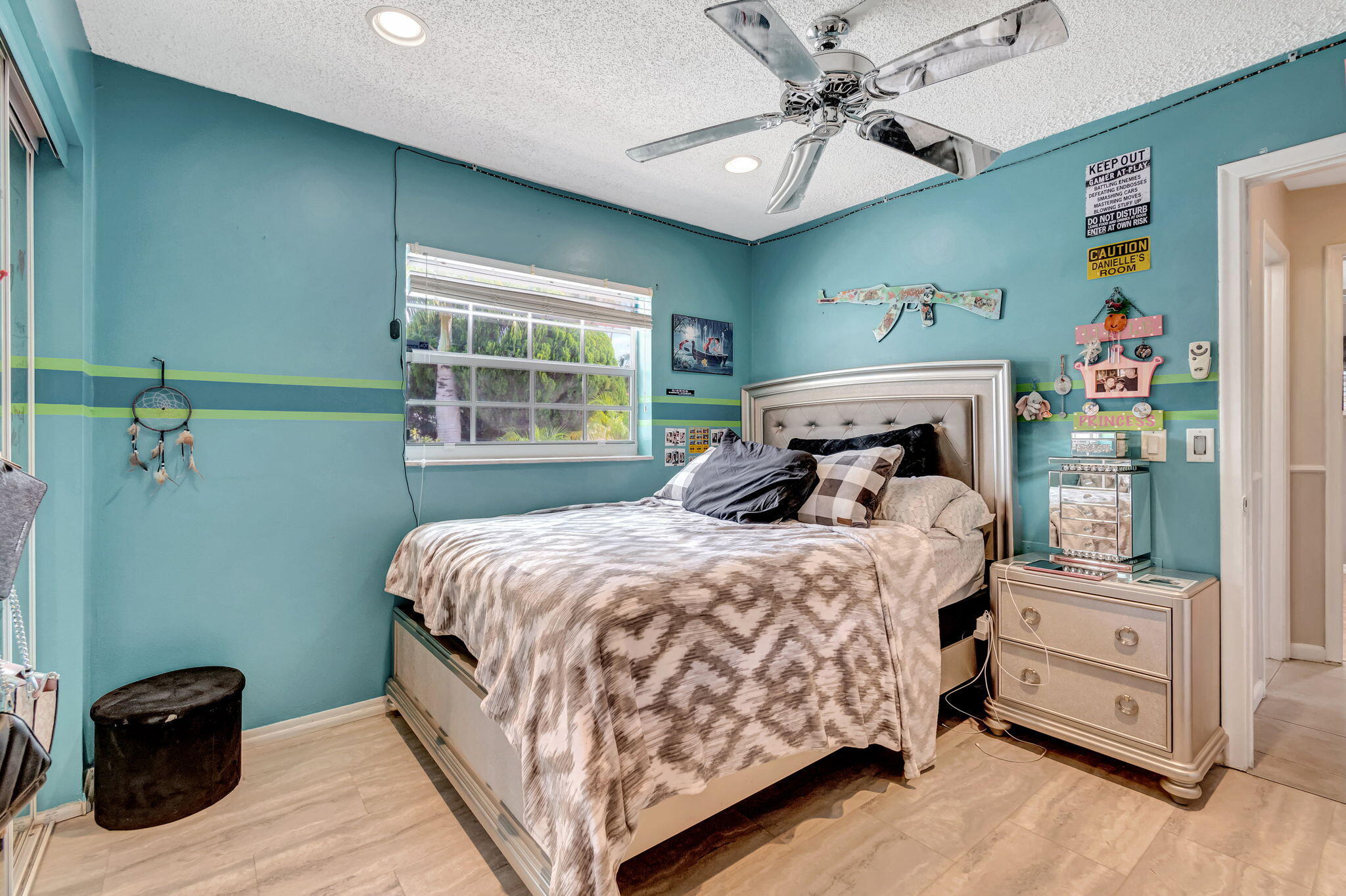 4557 Avalon Street Boca Raton, FL 33428 - Photo 30 of 47 a bedroom with a bed and a window