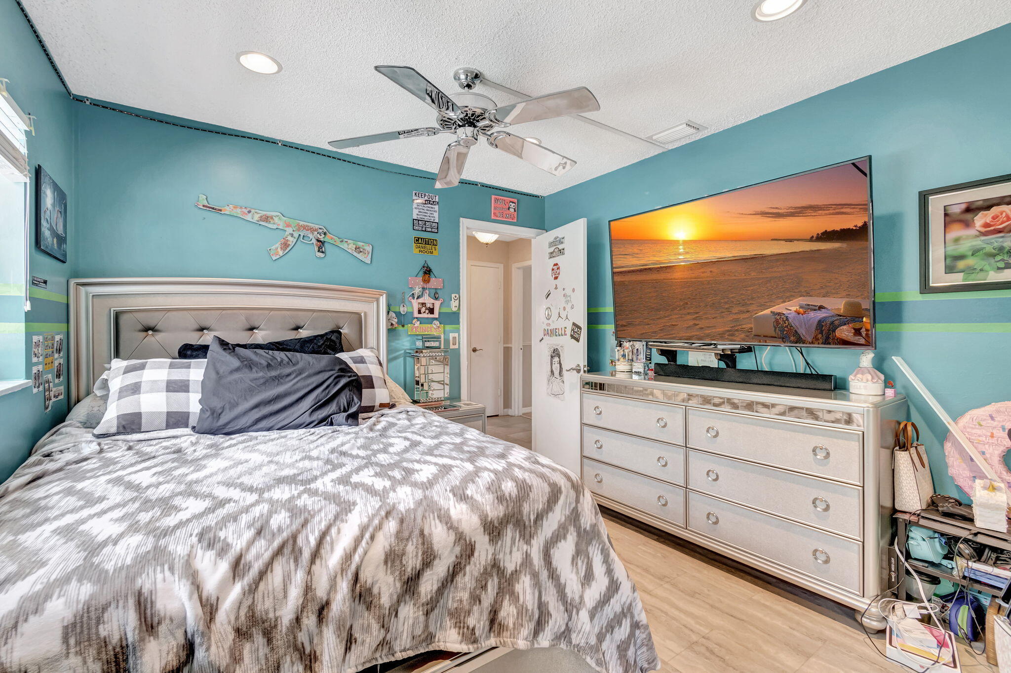 4557 Avalon Street Boca Raton, FL 33428 - Photo 31 of 47 a bedroom with a bed and a flat screen tv