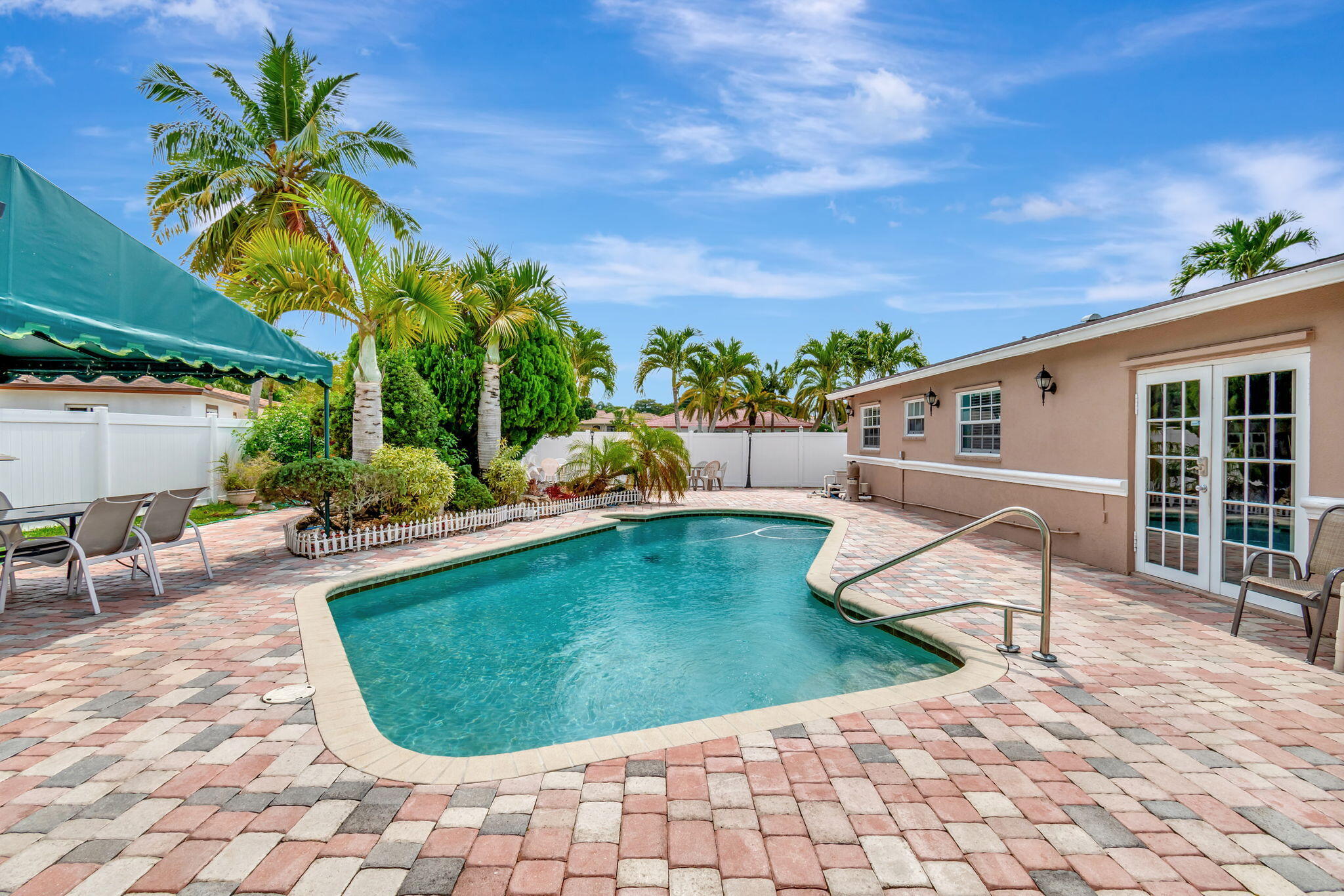 4557 Avalon Street Boca Raton, FL 33428 - Photo 35 of 47 a view of a swimming pool with lounge chair