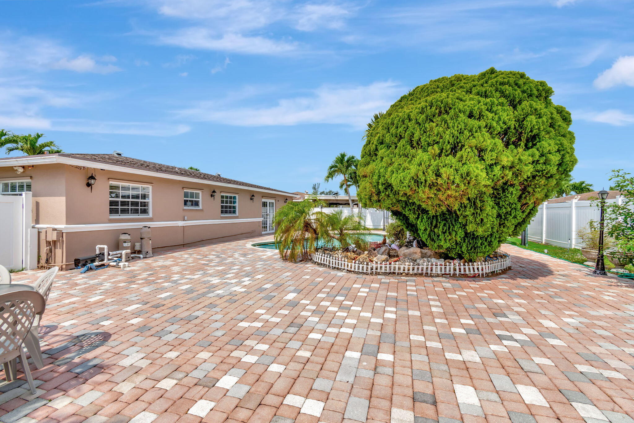 4557 Avalon Street Boca Raton, FL 33428 - Photo 40 of 47 a view of a house with a patio