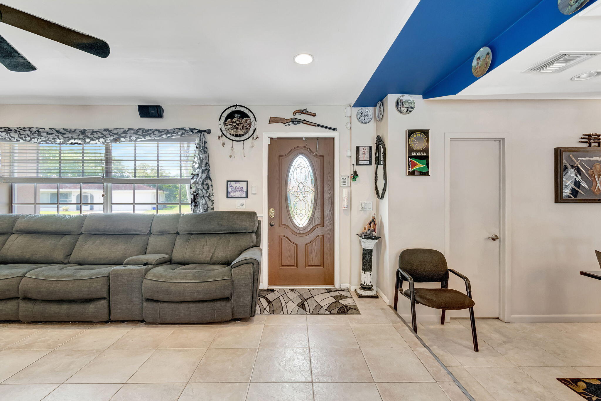 4557 Avalon Street Boca Raton, FL 33428 - Photo 5 of 47 a living room with furniture and a window