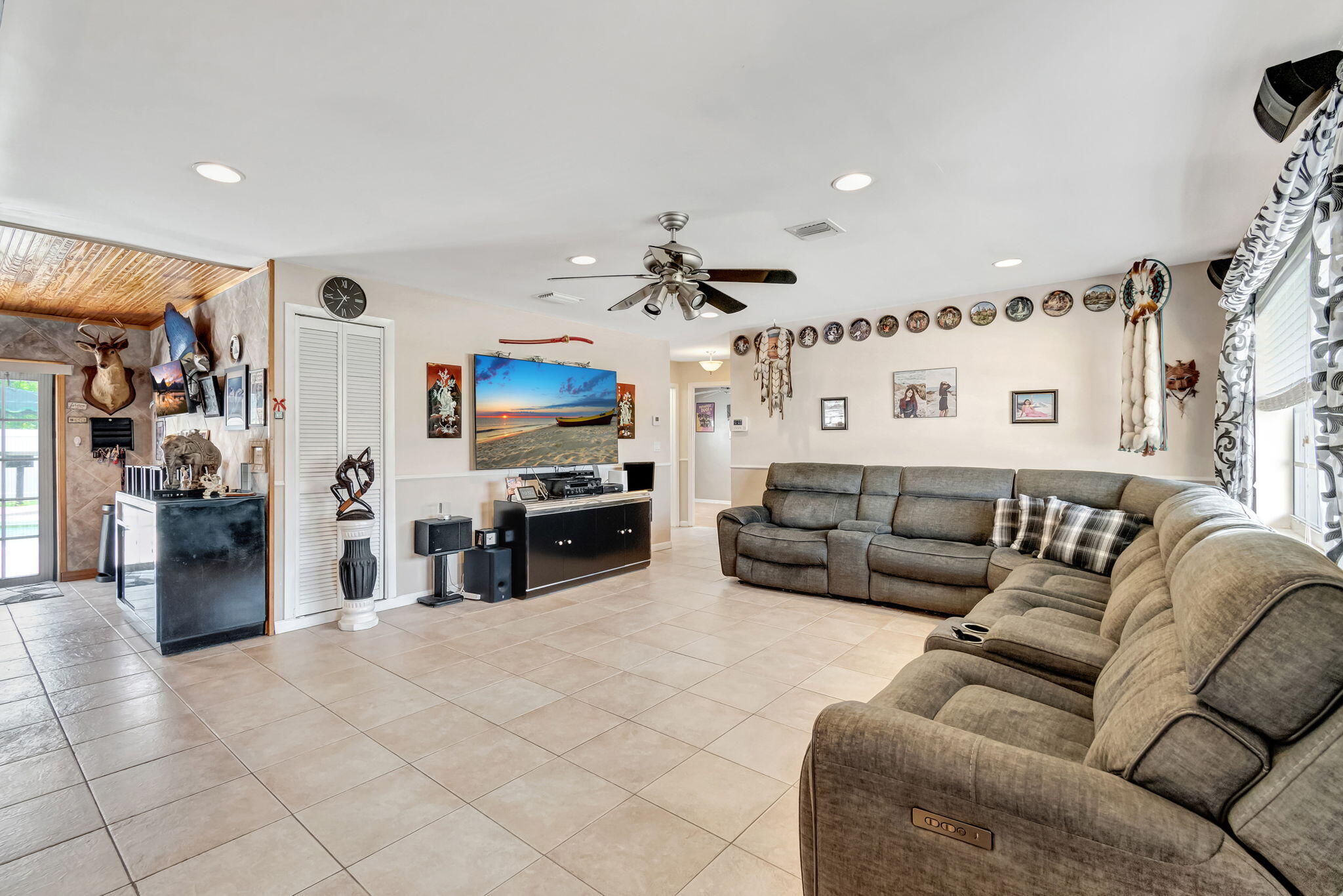 4557 Avalon Street Boca Raton, FL 33428 - Photo 6 of 47 a living room with furniture and kitchen view