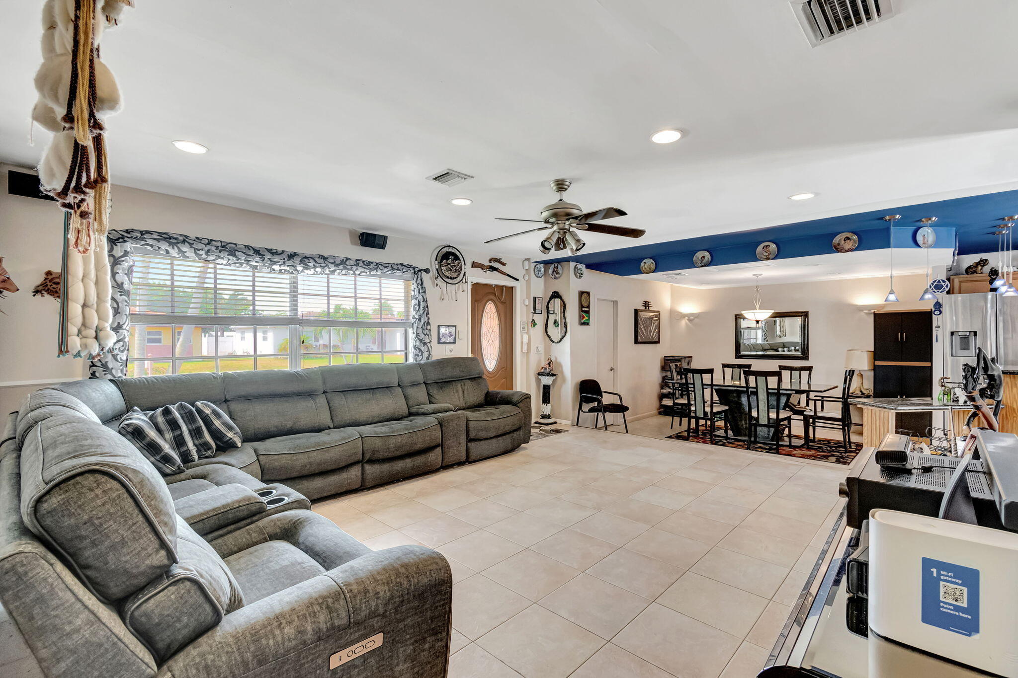 4557 Avalon Street Boca Raton, FL 33428 - Photo 9 of 47 a living room with furniture and a large window