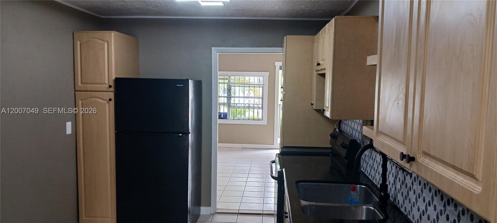 2272 Southwest 8th Street, Unit 3 Miami, FL 33135 - Photo 11 of 23 a view of an entryway with wooden floor and a livingroom