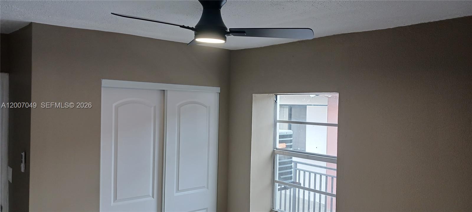 2272 Southwest 8th Street, Unit 3 Miami, FL 33135 - Photo 15 of 23 a view of an empty room with a window