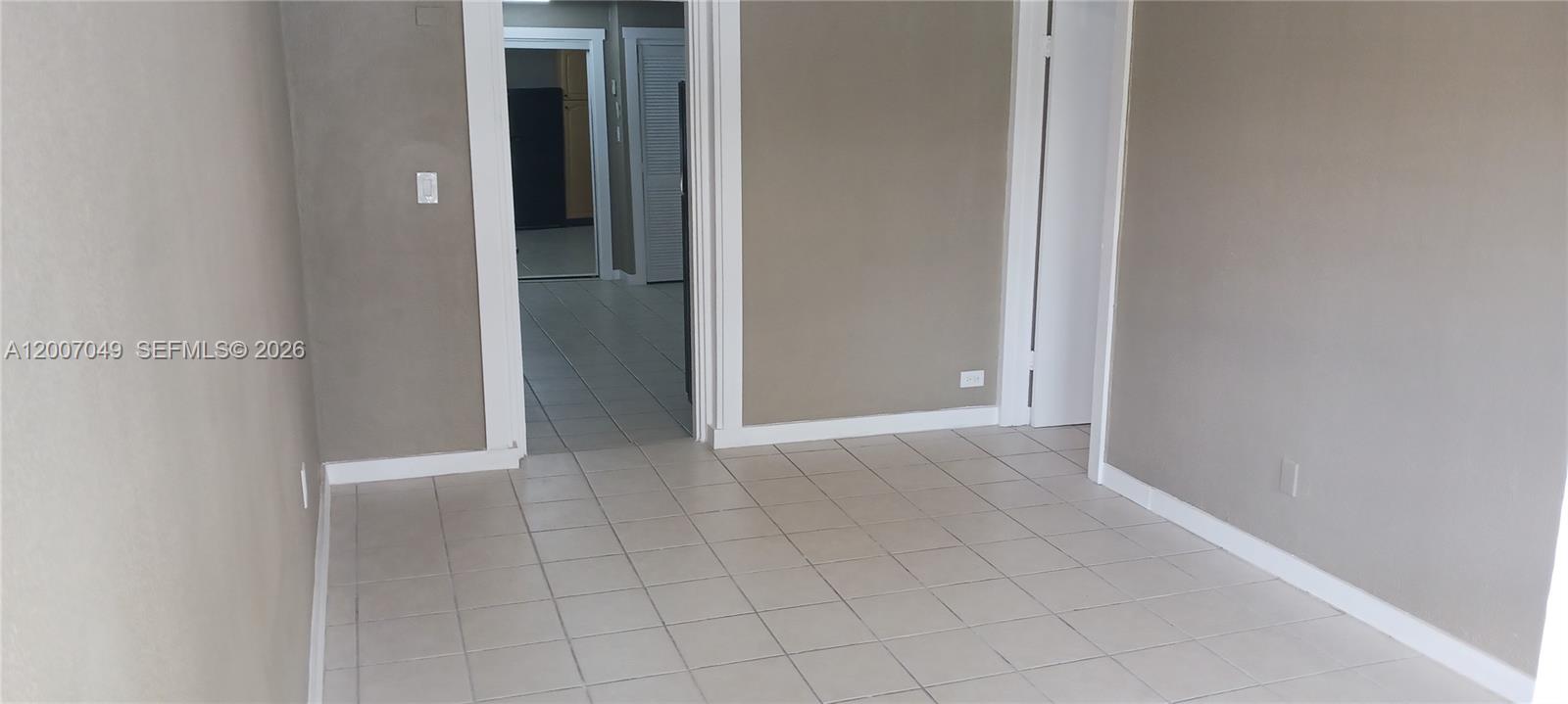 2272 Southwest 8th Street, Unit 3 Miami, FL 33135 - Photo 20 of 23 a view of an empty room with closet and mirror