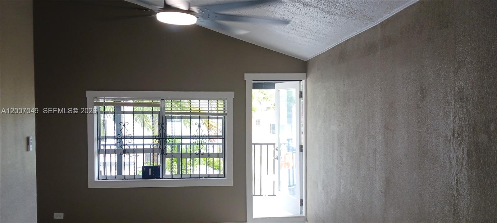 2272 Southwest 8th Street, Unit 3 Miami, FL 33135 - Photo 21 of 23 a view of an empty room with a window