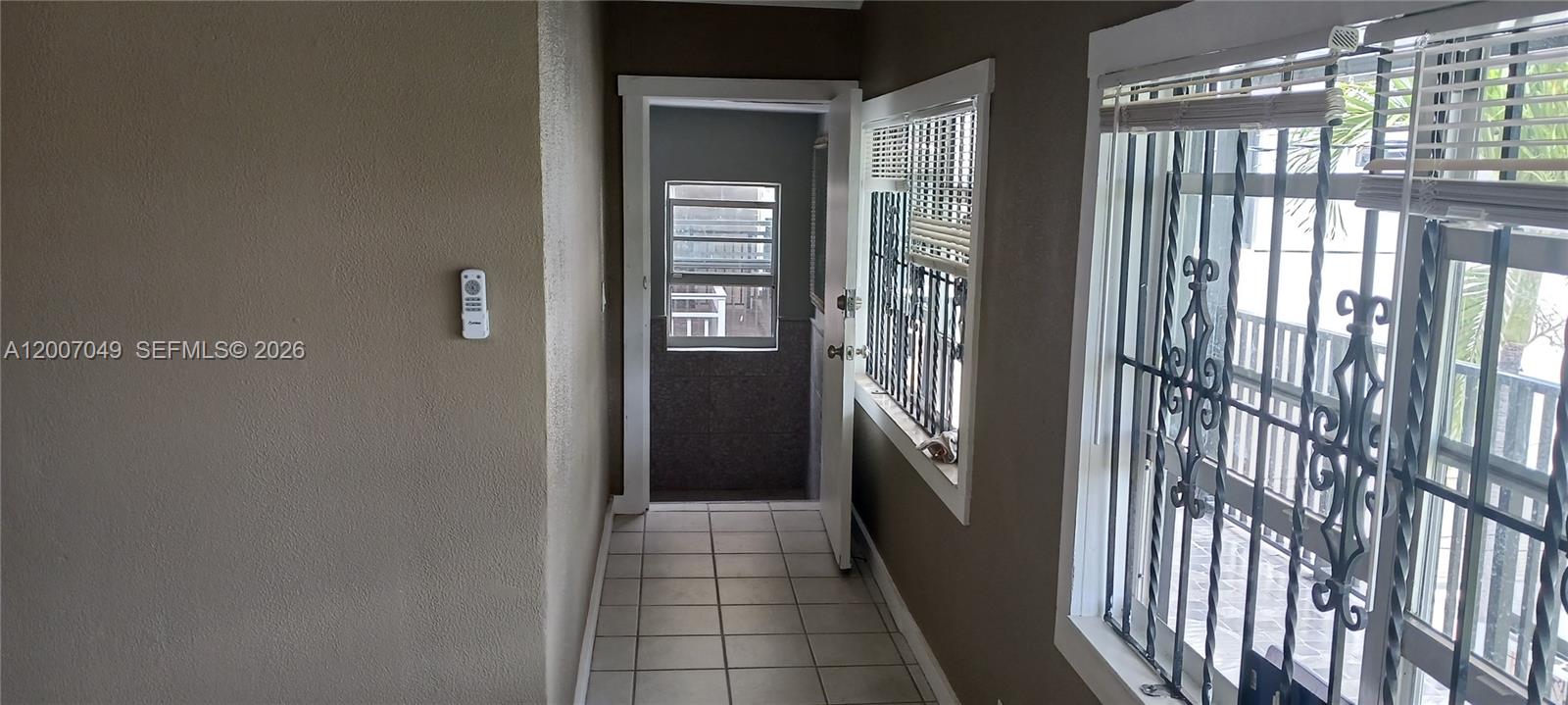 2272 Southwest 8th Street, Unit 3 Miami, FL 33135 - Photo 6 of 23 a view of a glass door and the balcony