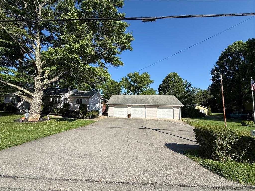 5122 McCandless Road Butler, PA 16001 - Photo 39 of 45 Huge driveway. Easily park 6 cars. Large gravel pad to the right of the garage for extra storage.