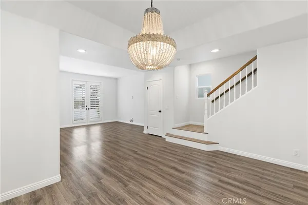 a view of an entryway with wooden floor