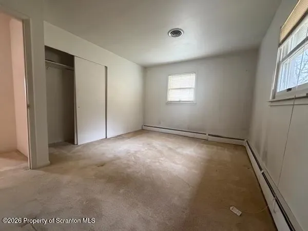 an empty room with windows